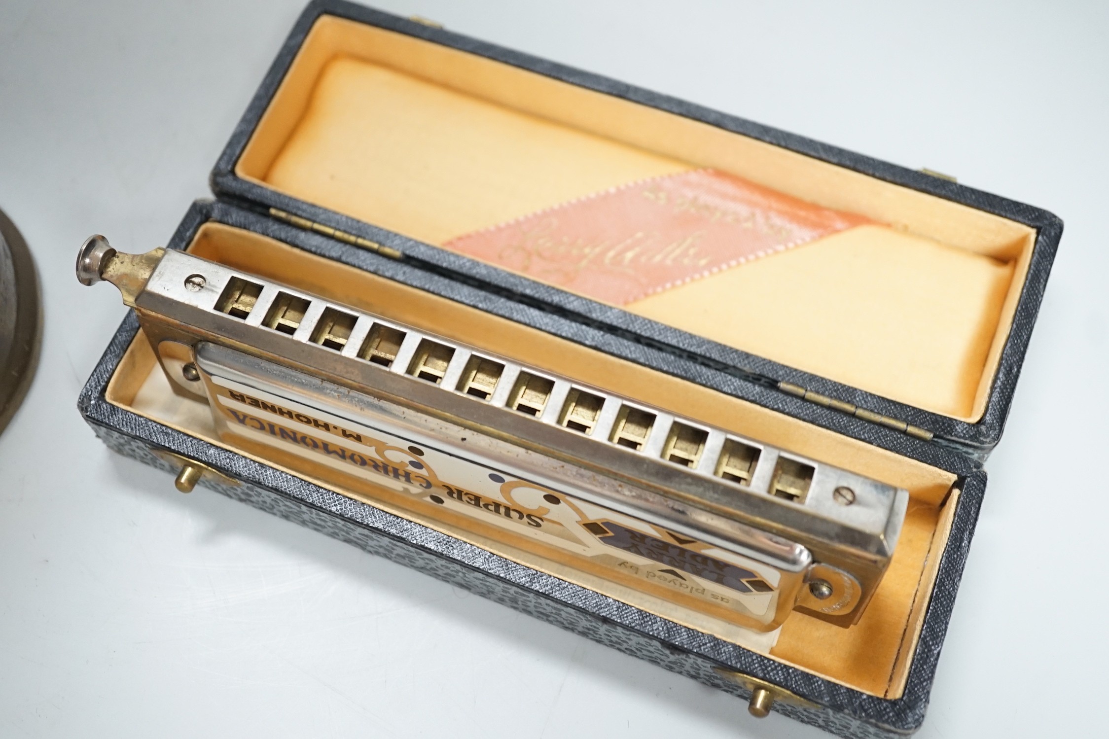 An Eccles miner’s lamp, 25cm high, together with a German harmonica